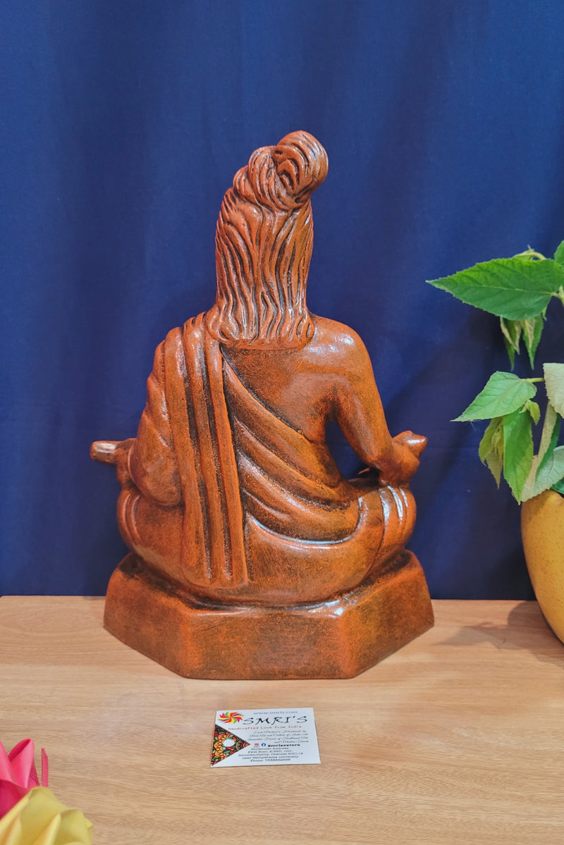 Thiruvalluvar sitting statue Orange wood color  showpiece table décor office décor papermache ( 13 H * 10 L * 5.5 W ) Inches