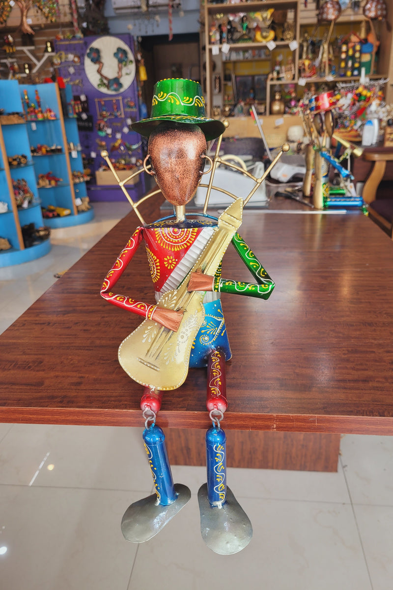 Musician Man with Guitar Green Cap with swinging legs Table Decor Iron (7L * 7W * 17H) inches Showpiece Return Gift Corporate Gift Showpiece Return Gift Corporate Gift